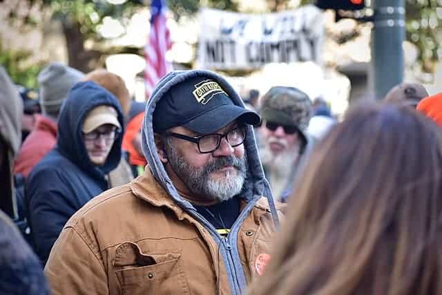 Who counts as a terrorist? A man wearing an oath keepers hat in richmond