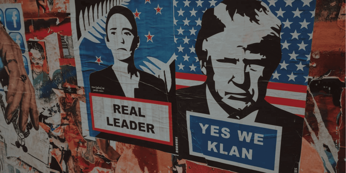 Posters and graffiti on a building in mexico. Posters feature mexican and u. S. Leaders. Mexican president’s poster says real leader. Donald trump poster sats yes we klan