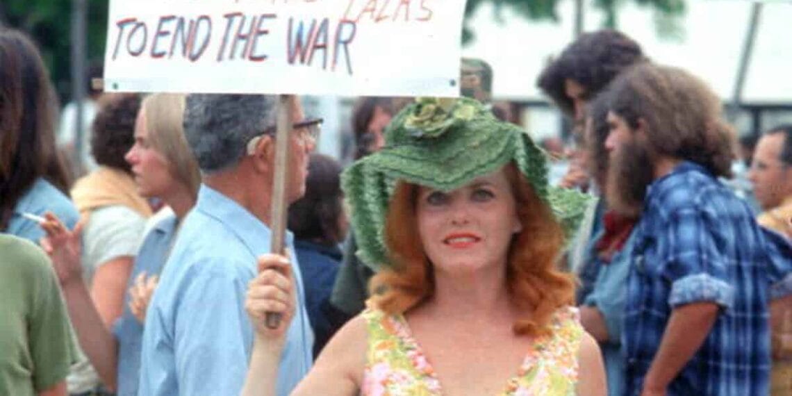 A woman protests at the rnc in miami in the 1970s