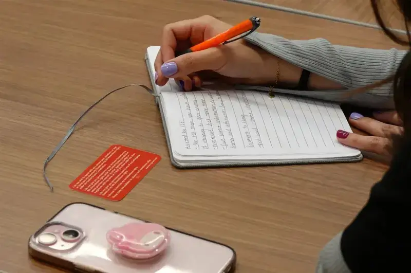 Community health clinic worker taking notes