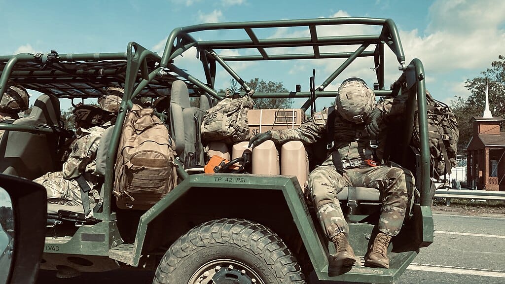 Fema aids in clean up and preparation. Exhausted military during cleanup after hurricane helene.
