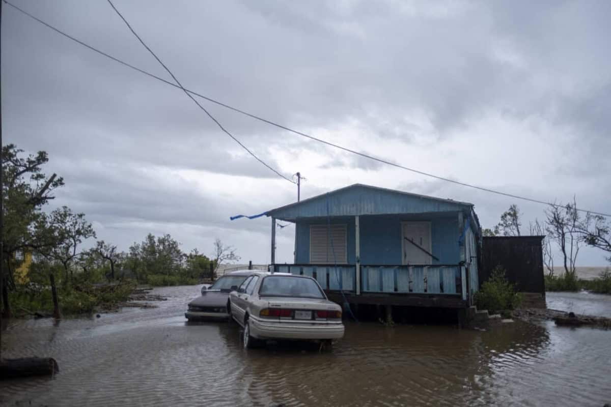 Research in puerto rico is important because of this: dark, stormy skies and flooding of a home and 2 cars
