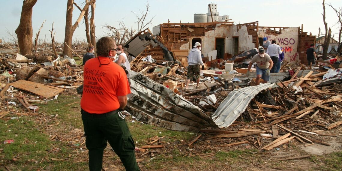 Americorps members clean up after a tornado