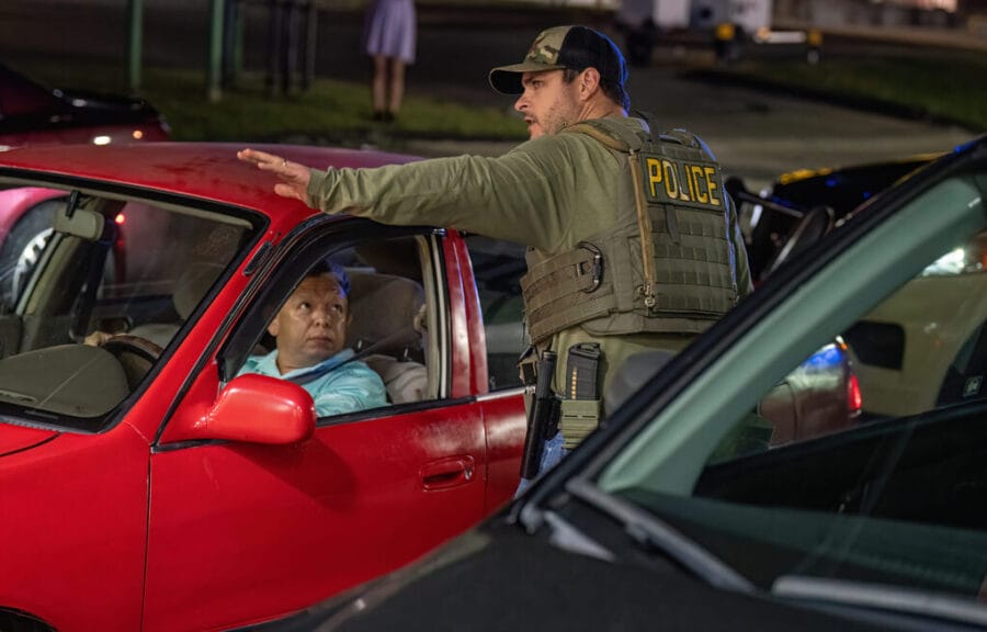 The ice agent directs the driver to pull aside.
