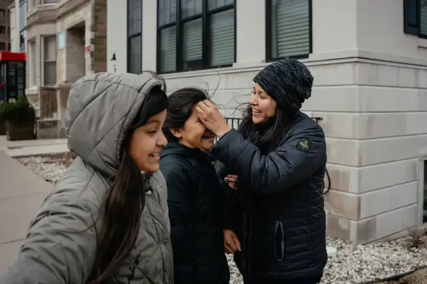 Yessenia ruano fixing her daughter’s hair