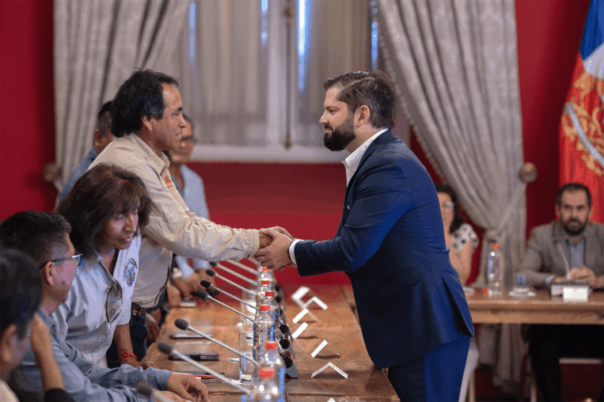 Two men shaking hands in the global south